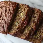 Naturally rubbery zucchini bread slice showing dense texture.