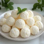 Frozen cream puffs on plate